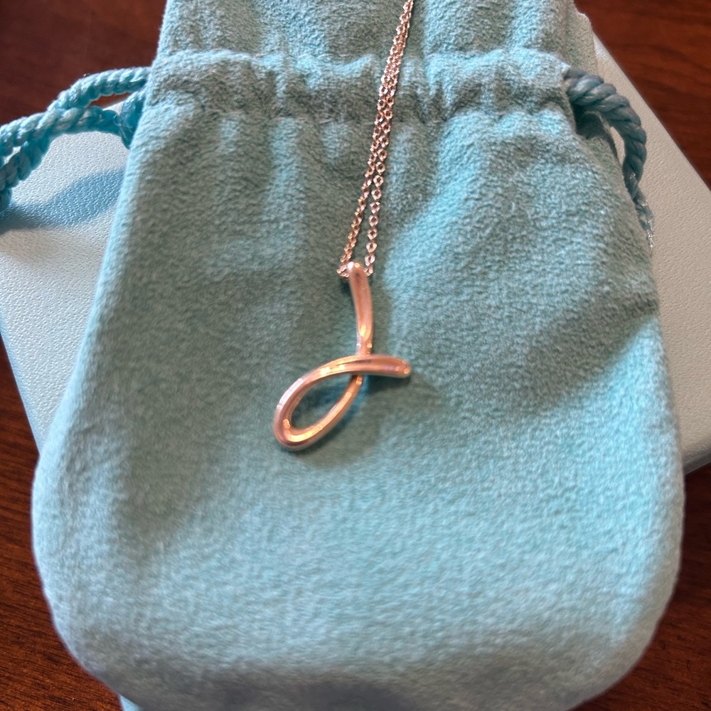 Sterling silver Tiffany’s Elsa Peretti letter J necklace.